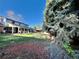 Expansive backyard features a covered patio with dining set and mature landscaping at 4640 W Princeton Ave, Denver, CO 80236