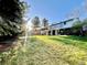 Expansive backyard with lush lawn and mature trees offers ample space and privacy at 4640 W Princeton Ave, Denver, CO 80236