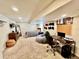 Finished basement featuring a bed, desk and large leaning mirror on carpeted floor at 4640 W Princeton Ave, Denver, CO 80236