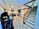 Finished basement featuring a finished staircase, sliding door, and entertainment center at 4640 W Princeton Ave, Denver, CO 80236