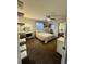 Serene bedroom with a vanity, ceiling fan, ample natural light, and carpet flooring at 4640 W Princeton Ave, Denver, CO 80236