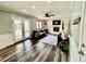 Comfortable living room with a fireplace, French doors leading to the backyard, and stylish decor at 4640 W Princeton Ave, Denver, CO 80236