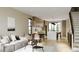 Open floor plan boasts modern kitchen with island and adjacent living area at 4640 Tennyson St # 29, Denver, CO 80212