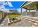 Backyard featuring a fire pit, patio, well-maintained lawn, and mature landscaping at 10991 Xanadu St, Commerce City, CO 80022