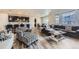Open-concept living space connects the kitchen, dining, and living areas, perfect for entertaining at 10991 Xanadu St, Commerce City, CO 80022