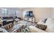 Cozy living room with large windows, modern furniture, and stylish decor at 10991 Xanadu St, Commerce City, CO 80022