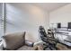 Office area with neutral walls, and a desk with a comfortable desk chair at 10991 Xanadu St, Commerce City, CO 80022