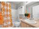 Bathroom featuring a decorative orange patterned shower curtain at 4357 W 118Th Pl, Westminster, CO 80031