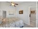 Bright bedroom with a ceiling fan and ensuite bathroom access at 4357 W 118Th Pl, Westminster, CO 80031