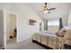 Bright bedroom featuring a walk-in closet and view of the cityscape at 4357 W 118Th Pl, Westminster, CO 80031
