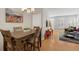 Open floor plan with dining area flowing into the living room and bright natural light at 4357 W 118Th Pl, Westminster, CO 80031