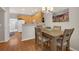 Charming dining area connected to kitchen, featuring a chandelier and ample natural light at 4357 W 118Th Pl, Westminster, CO 80031