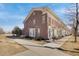 Exterior view of a brick multi-Gathering townhome featuring manicured landscaping and a sidewalk at 4357 W 118Th Pl, Westminster, CO 80031