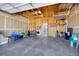 This large, unfinished garage has ample storage space with pegboards and overhead shelving at 4357 W 118Th Pl, Westminster, CO 80031