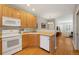 Efficient kitchen layout with maple cabinets, updated appliances and open to the living area at 4357 W 118Th Pl, Westminster, CO 80031