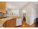 Bright kitchen features wood floors, white appliances, and an open design with a view to the adjacent dining area at 4357 W 118Th Pl, Westminster, CO 80031