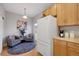 Bright kitchenette boasts modern appliances and a cozy sitting area at 4357 W 118Th Pl, Westminster, CO 80031