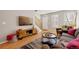 Comfortable living room with hardwood flooring, stairs and natural light, perfect for relaxation at 4357 W 118Th Pl, Westminster, CO 80031