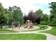 Enjoy the community playground with swings, a slide, benches and mature landscaping at 7233 S Harrison Way, Centennial, CO 80122