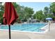 Enjoy the community swimming pool with a lifeguard, lounge chairs and shade umbrellas at 7233 S Harrison Way, Centennial, CO 80122