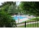 Relax at the community pool featuring a lifeguard, chairs, and a charming pool house at 7233 S Harrison Way, Centennial, CO 80122