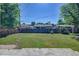 Spacious backyard with well-maintained lawn and wooden fence at 6054 Iris Way, Arvada, CO 80004