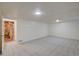Finished basement area with carpet at 6054 Iris Way, Arvada, CO 80004