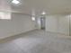Finished basement area with carpet at 6054 Iris Way, Arvada, CO 80004