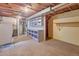 Basement featuring laundry room area with washer, dryer, shelving and utilities at 6054 Iris Way, Arvada, CO 80004