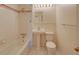 The clean and well maintained bathroom has a shower and a pedestal sink at 6054 Iris Way, Arvada, CO 80004