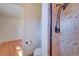 Small renovated bathroom with stone shower and fixtures at 6054 Iris Way, Arvada, CO 80004