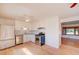 Bright kitchen with white cabinets, stainless steel appliances, and hardwood floors at 6054 Iris Way, Arvada, CO 80004