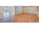 Spacious living room featuring beautiful hardwood floors and ample natural light at 6054 Iris Way, Arvada, CO 80004