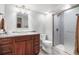 Well-lit bathroom boasting a granite vanity and a modern tiled shower at 10000 E Yale Ave # 41, Denver, CO 80231