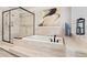 Bathroom showcasing a tub with shower, neutral tile, and modern hardware at 10000 E Yale Ave # 41, Denver, CO 80231