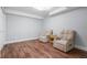 Cozy bedroom with wood floors and two comfortable armchairs at 10000 E Yale Ave # 41, Denver, CO 80231