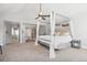 Bright bedroom with vaulted ceiling, canopy bed and en suite bath with marble shower at 10000 E Yale Ave # 41, Denver, CO 80231