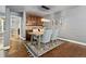 Dining room with hardwood floors, stylish lighting, and custom built-in bar area at 10000 E Yale Ave # 41, Denver, CO 80231