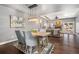 Cozy dining room with hardwood floors and views into the living room at 10000 E Yale Ave # 41, Denver, CO 80231