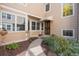 Inviting entrance to home with a covered porch, manicured landscaping, and warm curb appeal at 10000 E Yale Ave # 41, Denver, CO 80231