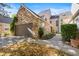 Attached two-car garage featuring a stone facade and ample parking space at 10000 E Yale Ave # 41, Denver, CO 80231