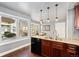 Kitchen area offering modern appliances, generous natural light, and wood finishings at 10000 E Yale Ave # 41, Denver, CO 80231