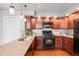 Kitchen featuring stainless steel appliances, wood cabinets and lots of counter space at 10000 E Yale Ave # 41, Denver, CO 80231