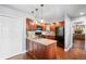 Kitchen with wood cabinets, stainless steel appliances, and an island with sink at 10000 E Yale Ave # 41, Denver, CO 80231