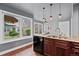 Charming kitchen with ample counter space, dark wood cabinets, breakfast nook with windows at 10000 E Yale Ave # 41, Denver, CO 80231