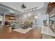 Open concept living room featuring hardwood floors, gray sofa and easy access to kitchen at 10000 E Yale Ave # 41, Denver, CO 80231