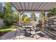Cozy patio area with pergola, outdoor seating, and lush greenery at 10000 E Yale Ave # 41, Denver, CO 80231