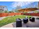 The yard has patio seating, a fire pit, and a large green lawn with trees at 18477 E Amherst Dr, Aurora, CO 80013