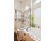 Bathroom featuring a bathtub and marble walk-in shower at 18477 E Amherst Dr, Aurora, CO 80013