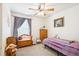 Cozy bedroom featuring carpet floors, natural light, and furnishings with a cute teddy bear toy theme at 18477 E Amherst Dr, Aurora, CO 80013